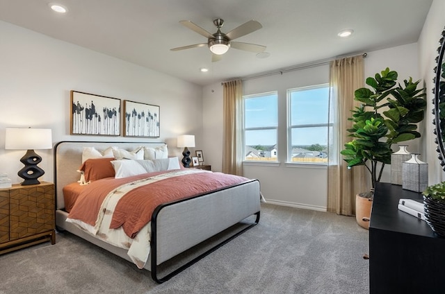 carpeted bedroom featuring recessed lighting, a ceiling fan, and baseboards