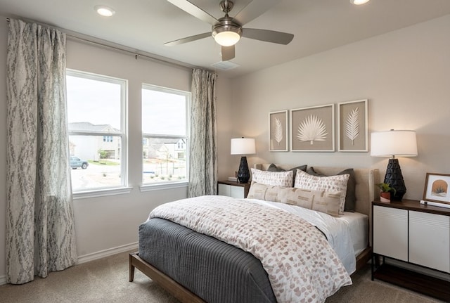 carpeted bedroom featuring baseboards, recessed lighting, ceiling fan, and visible vents