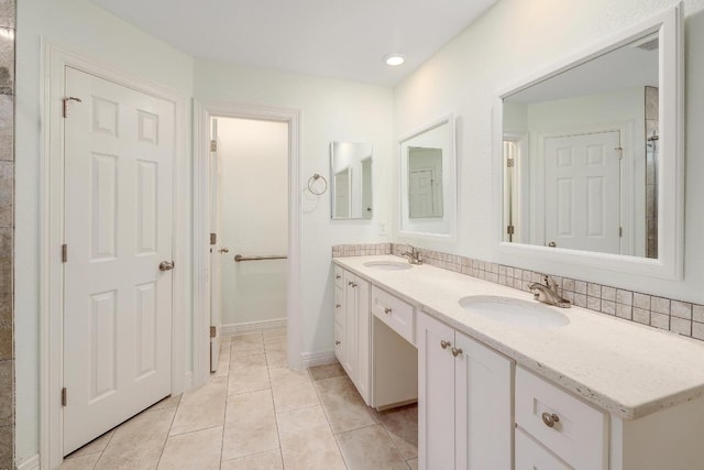 4303 Everest Ln, Austin, TX 78727 - bathroom featuring double vanity, a sink, tile patterned floors, and visible vents