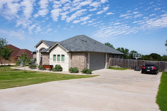 1066 Vista Dr, Salado, TX 76571 - view of front of home with driveway, a garage, stone siding, and brick siding