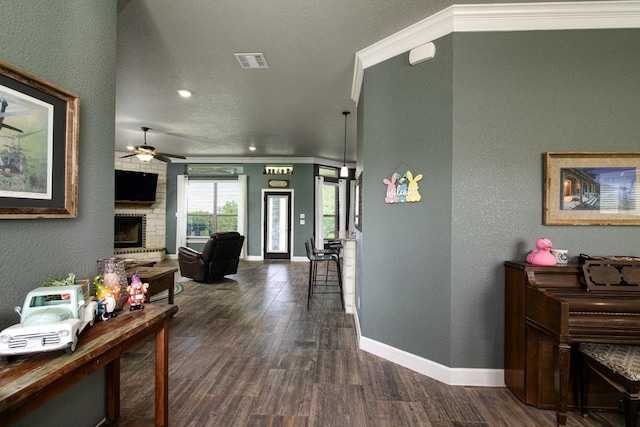 1066 Vista Dr, Salado, TX 76571 - hallway featuring dark wood-style floors, baseboards, a textured wall, and recessed lighting