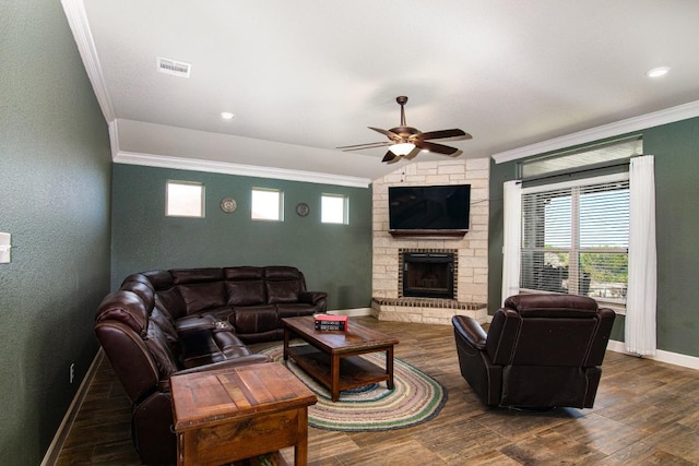 1066 Vista Dr, Salado, TX 76571 - living area with crown molding, a ceiling fan, a fireplace, dark wood finished floors, and baseboards