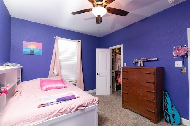 1066 Vista Dr, Salado, TX 76571 - carpeted bedroom with a spacious closet, a ceiling fan, baseboards, and a closet