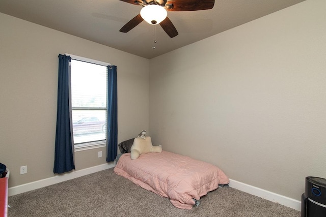 1066 Vista Dr, Salado, TX 76571 - carpeted bedroom featuring multiple windows, baseboards, and a ceiling fan