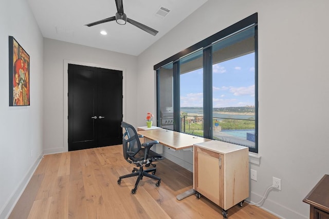 18304 Cedar Sage Ct, Lago Vista, TX 78645 - office space featuring baseboards, ceiling fan, light wood-style flooring, and visible vents