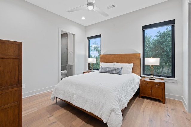18304 Cedar Sage Ct, Lago Vista, TX 78645 - bedroom with recessed lighting, baseboards, ensuite bathroom, light wood-type flooring, and visible vents