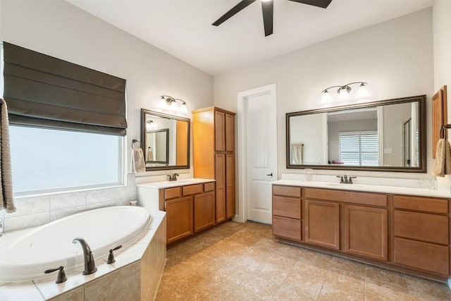 2917 Windy Vane Dr, Pflugerville, TX 78660 - full bathroom with ceiling fan, two vanities, a bath, and tile patterned floors
