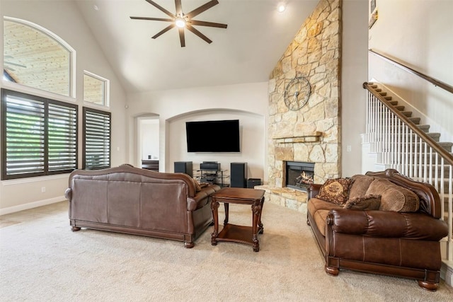 2917 Windy Vane Dr, Pflugerville, TX 78660 - living room with ceiling fan, high vaulted ceiling, carpet floors, a fireplace, and arched walkways