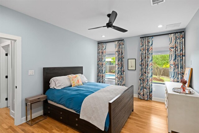 bedroom with visible vents, recessed lighting, light wood finished floors, and baseboards
