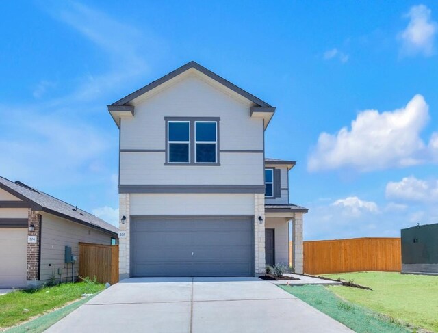 200 Lucky Texan Rd, Jarrell, TX 76537 - view of front of house featuring an attached garage and concrete driveway