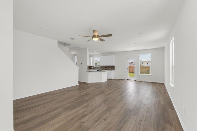 200 Lucky Texan Rd, Jarrell, TX 76537 - unfurnished living room with ceiling fan, dark wood-type flooring, and recessed lighting
