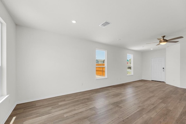 200 Lucky Texan Rd, Jarrell, TX 76537 - spare room with wood finished floors, ceiling fan, and recessed lighting