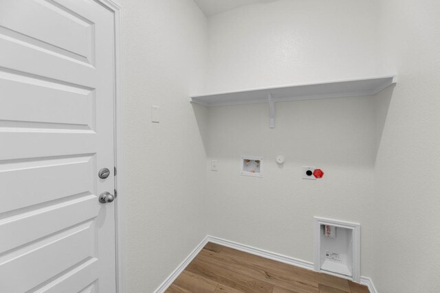 200 Lucky Texan Rd, Jarrell, TX 76537 - laundry area featuring hookup for a gas dryer, hookup for an electric dryer, wood finished floors, and washer hookup