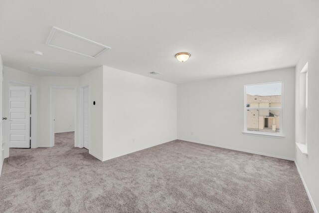 200 Lucky Texan Rd, Jarrell, TX 76537 - carpeted empty room featuring attic access and baseboards