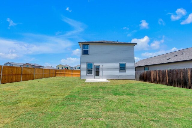200 Lucky Texan Rd, Jarrell, TX 76537 - rear view of property featuring a fenced backyard and a patio area