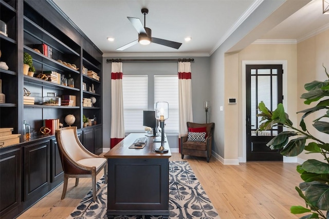 office area featuring ornamental molding, light wood-style flooring, and ceiling fan