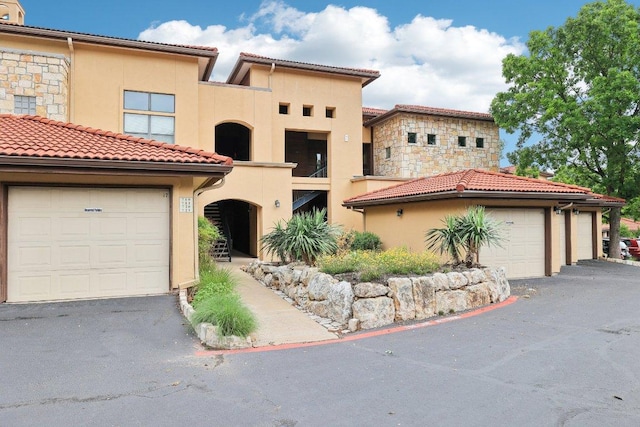 300 San Gabriel Village Blvd Unit 721, Georgetown, TX 78626 - view of front facade with stucco siding and a tile roof