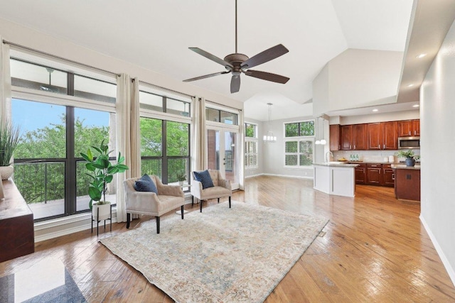 300 San Gabriel Village Blvd Unit 721, Georgetown, TX 78626 - living area with a ceiling fan, light wood finished floors, baseboards, high vaulted ceiling, and recessed lighting