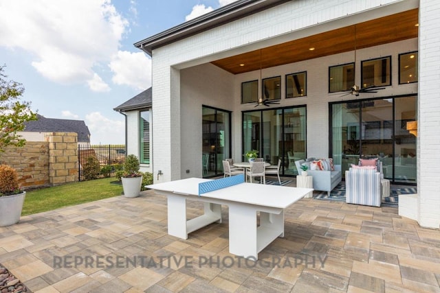 view of patio / terrace with outdoor lounge area and fence