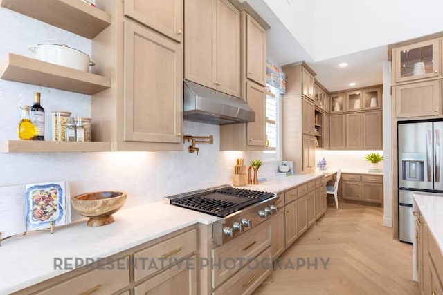 kitchen with open shelves, under cabinet range hood, glass insert cabinets, and stainless steel appliances
