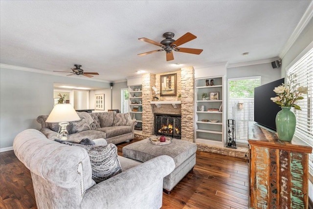 10601 Spicewood Pkwy, Austin, TX 78750 - living area featuring ceiling fan, hardwood / wood-style floors, a fireplace, crown molding, and baseboards
