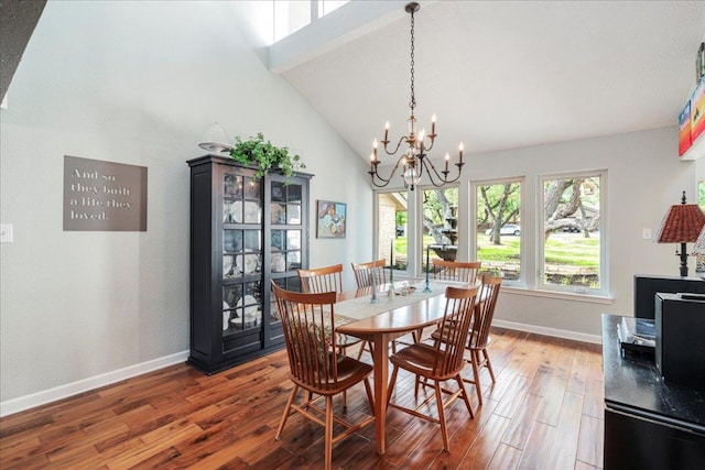 10601 Spicewood Pkwy, Austin, TX 78750 - dining space featuring wood finished floors, baseboards, a chandelier, and high vaulted ceiling