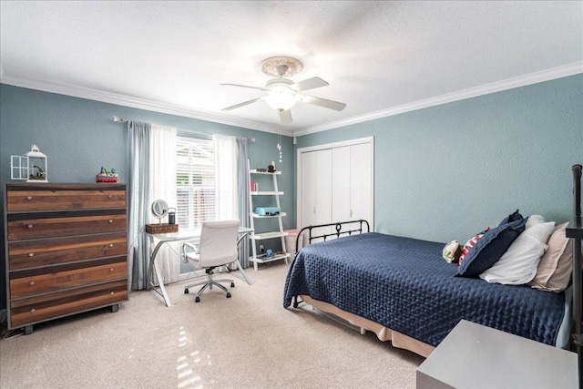 bedroom featuring crown molding, a textured wall, and carpet floors