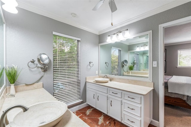 ensuite bathroom with vanity, a ceiling fan, baseboards, ensuite bathroom, and ornamental molding