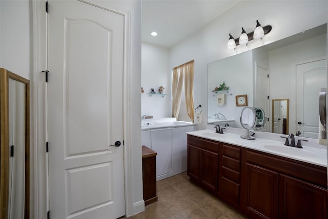 bathroom featuring double vanity, tile patterned floors, recessed lighting, and a sink