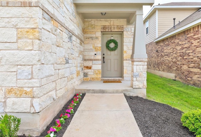 entrance to property featuring stone siding