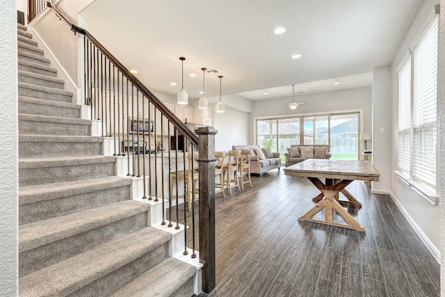 interior space featuring recessed lighting, ceiling fan, baseboards, and wood finished floors