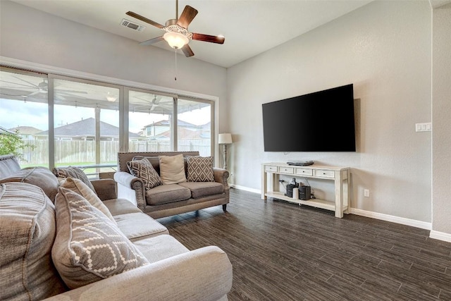 living area with baseboards, a ceiling fan, dark wood-type flooring, and visible vents
