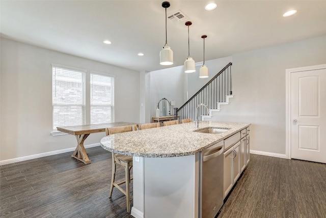 kitchen featuring a sink, visible vents, dark wood finished floors, and dishwasher