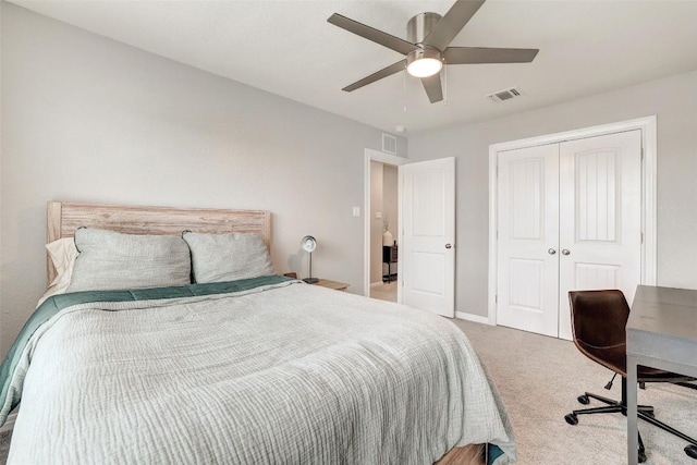 carpeted bedroom featuring baseboards, a ceiling fan, a closet, and visible vents