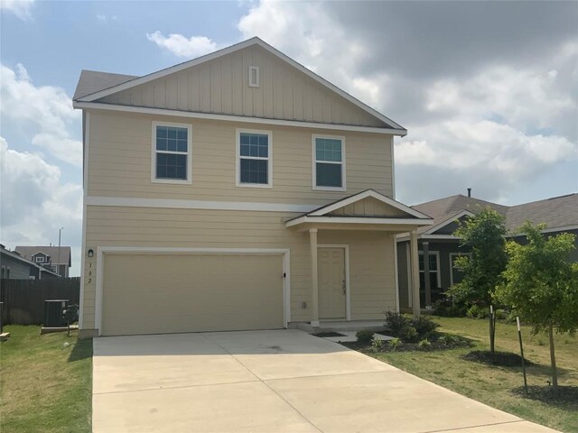 182 Geode Gln, Maxwell, TX 78656 - view of front of home featuring an attached garage, central AC, and driveway