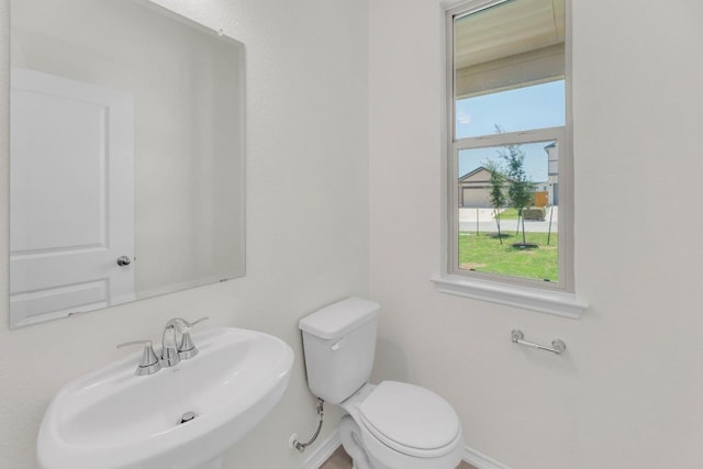 201 Lucky Texan Rd, Jarrell, TX 76537 - half bathroom with a sink and toilet