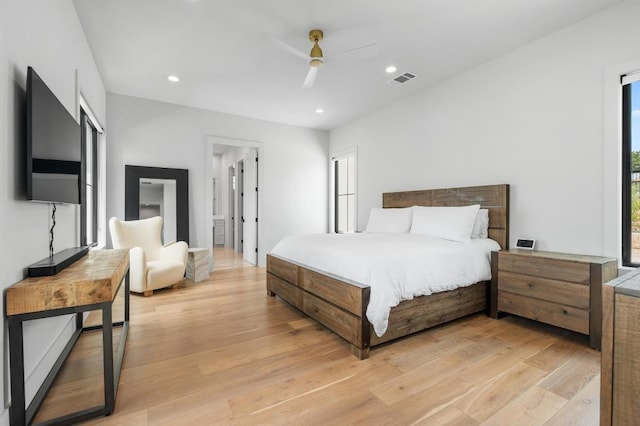 bedroom with light wood-type flooring, recessed lighting, a ceiling fan, and visible vents