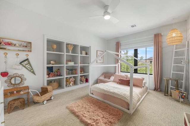 bedroom with carpet floors, ceiling fan, and visible vents