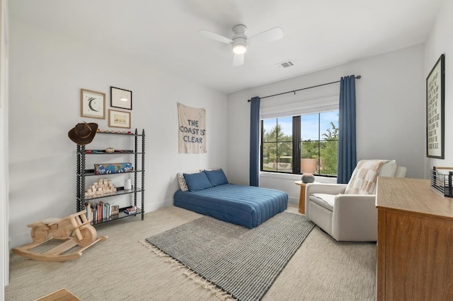 bedroom with carpet, a ceiling fan, and visible vents