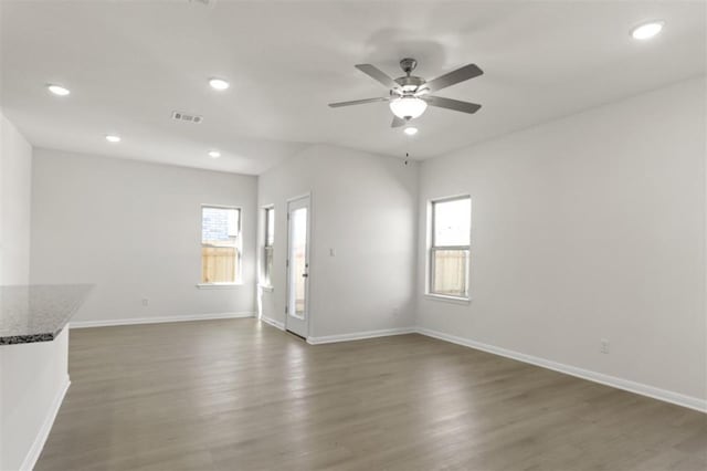 unfurnished living room featuring recessed lighting, visible vents, and wood finished floors