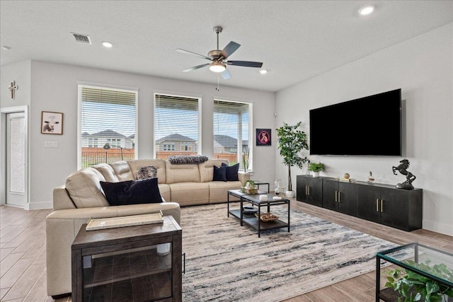 476 Wild Pecan Loop, Buda, TX 78610 - living room with light wood-style floors, a ceiling fan, baseboards, and recessed lighting