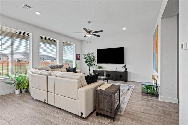 476 Wild Pecan Loop, Buda, TX 78610 - living room with ceiling fan, wood finish floors, baseboards, and recessed lighting
