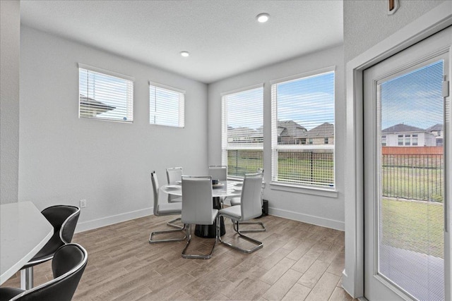 476 Wild Pecan Loop, Buda, TX 78610 - dining room featuring wood finished floors, baseboards, and recessed lighting