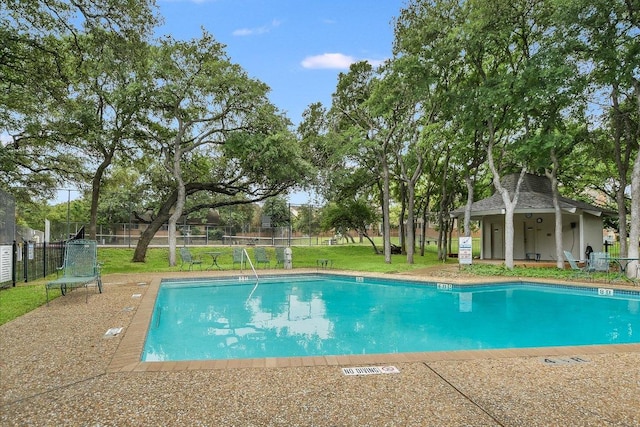 community pool featuring fence