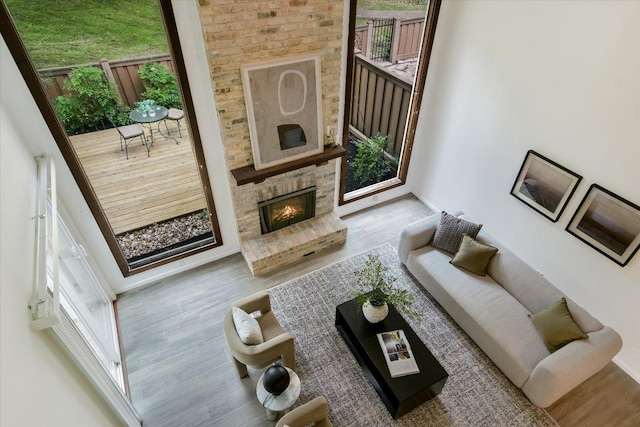 living area with wood finished floors and a fireplace