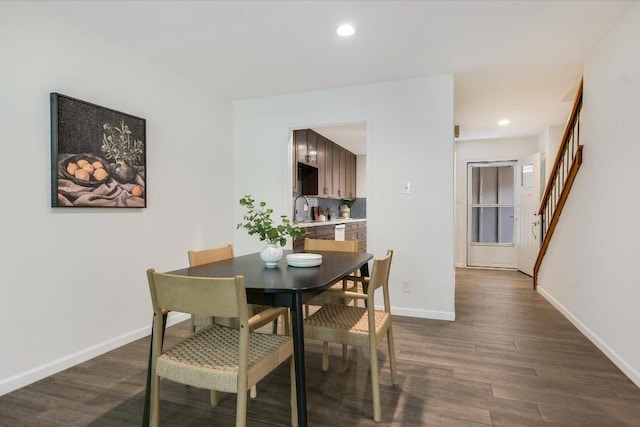 dining room with stairs, dark wood-style flooring, baseboards, and recessed lighting