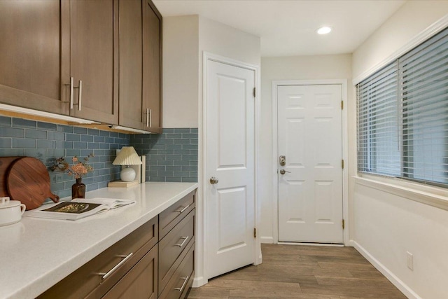 interior space featuring light wood-style floors, recessed lighting, and baseboards