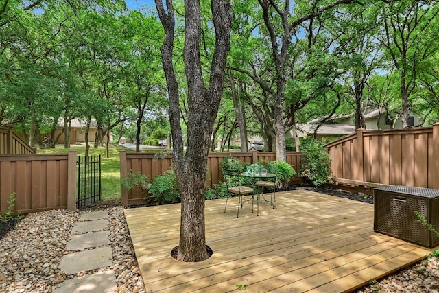 deck with a fenced backyard