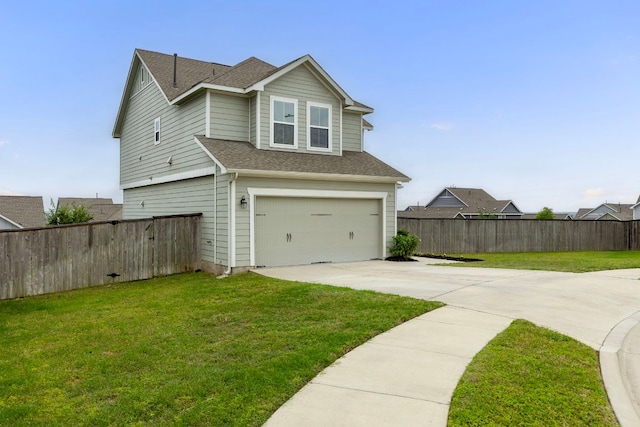 view of property exterior with a lawn, fence, an attached garage, and driveway
