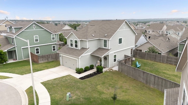 view of front of home featuring fence, a shingled roof, an attached garage, driveway, and a residential view